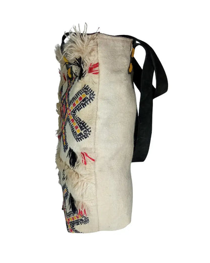 Embroidered bag with colorful patterns on a white background