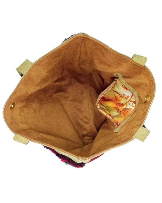 Detailed view of the tan suede shoulder straps and top panel of a handmade boho tote bag, showing the texture and stitching.