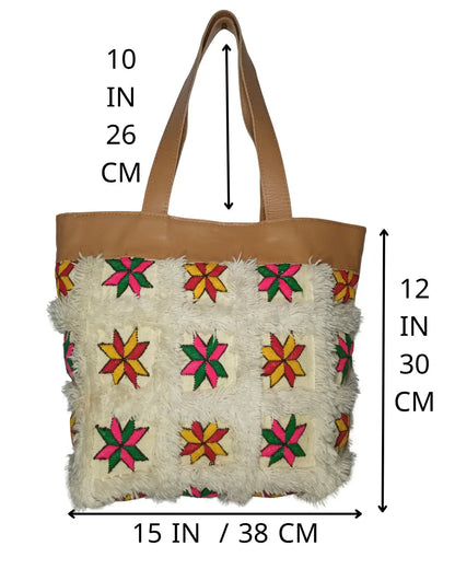 Tote bag with floral patterns and measurements on a white background