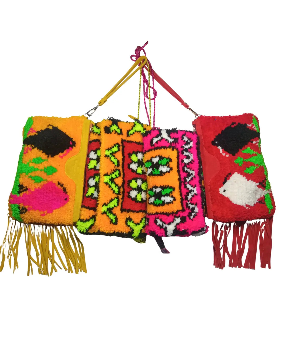 Front view of a small, handmade, rectangular tufted clutch bag. It features a neon orange background with a central floral design in lime green, pink, and black. A pink cord strap is visible above. Its dimensions are annotated.