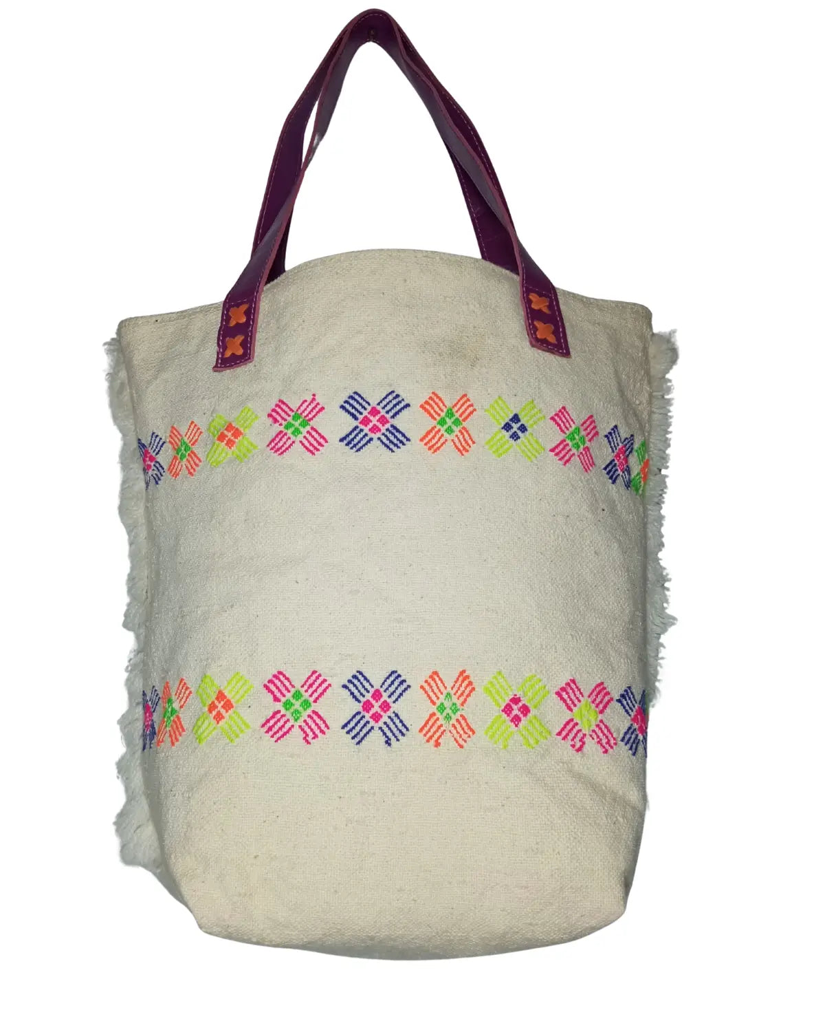 Detailed view of the vibrant neon embroidery on the white faux fur material of a retro tote bag, showing the star-shaped patterns in fuchsia, lime green, and orange.