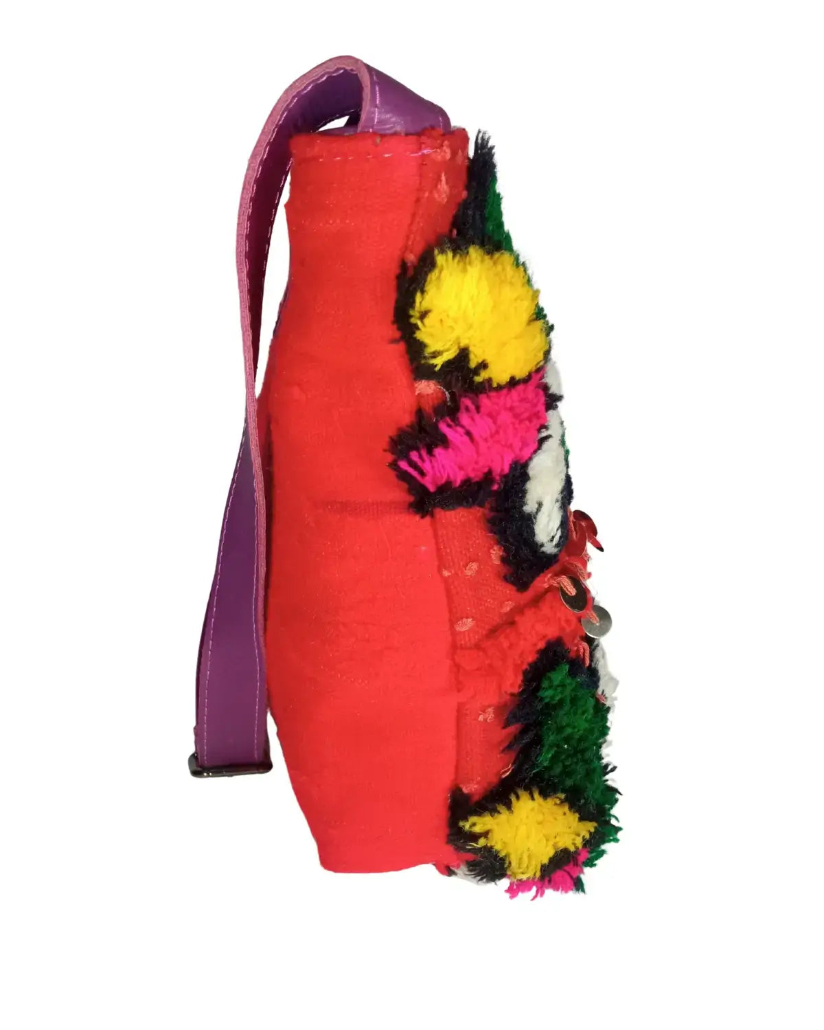 Red bag with colorful pom-pom details on a white background