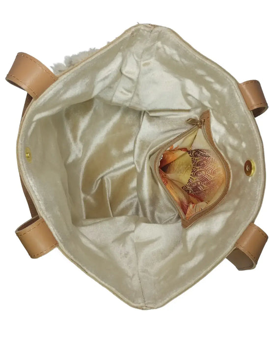 Top-down view of the open tote bag, showing a champagne satin lining, magnetic snap, and a small attached zippered pouch with a floral pattern.