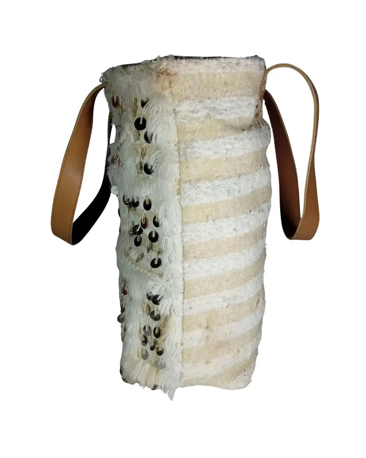 Textured bag with leather strap on a white background